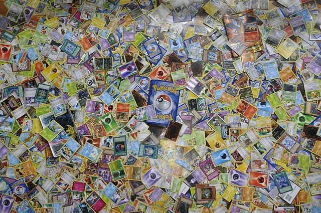A large pile of Pokémon cards